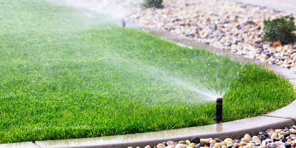 best way to water grass without a sprinkler system